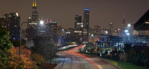 Chicago skyline at night — the destination Contact Limo serves daily from Kenosha via O'Hare, Midway, and the Chicago corridor