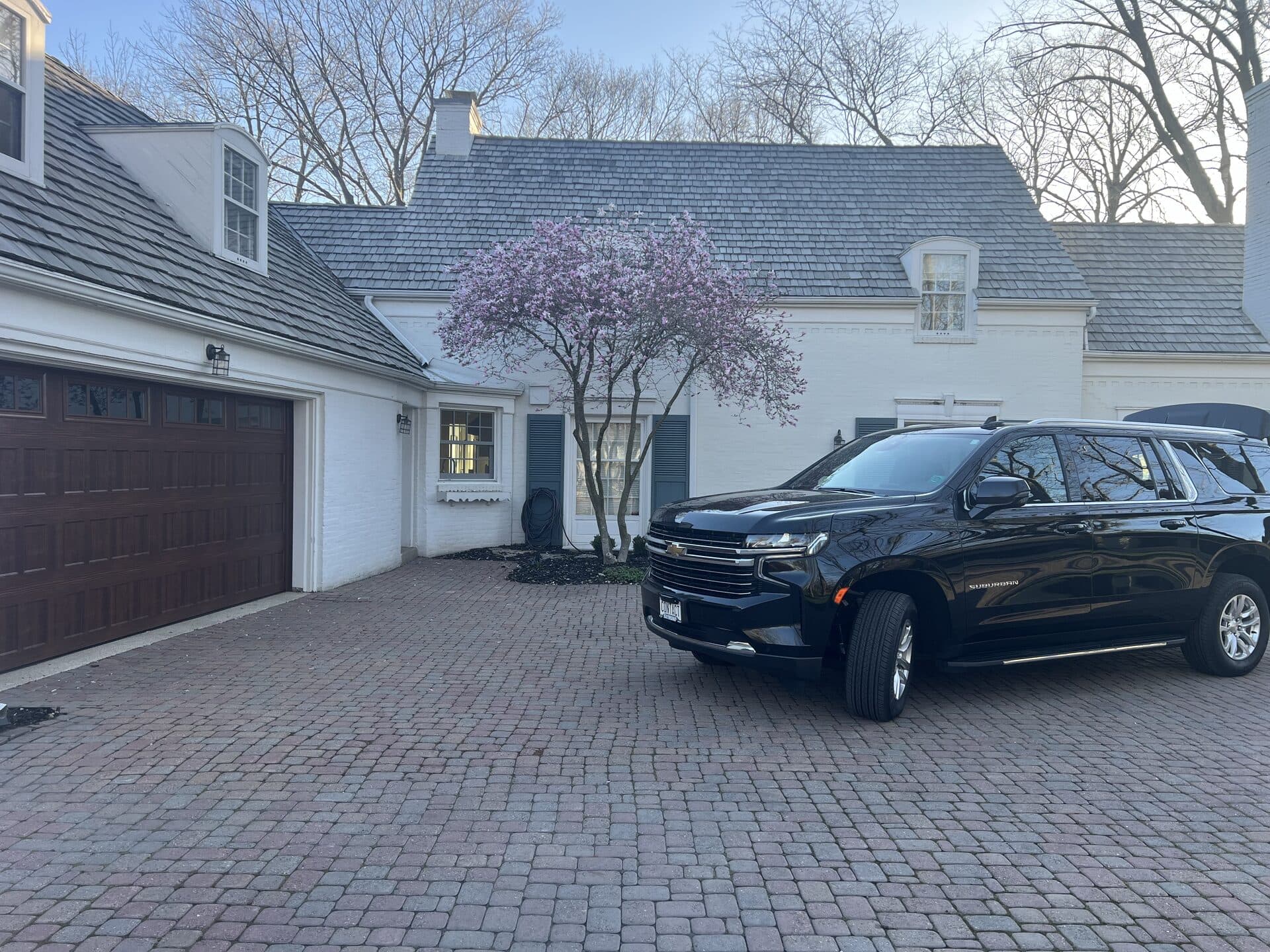 Contact Limo luxury SUV at residential pickup — private funeral transportation Kenosha and surrounding communities