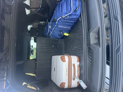 Contact Limo luxury SUV luggage cargo area — quoted before booking long-distance limo service beats rideshare for extended travel